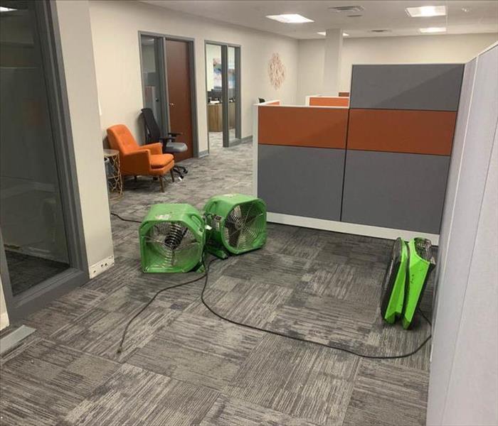 Drying equipment on floor in an office.